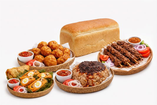 Assorted food items including bread, ram suya, moi moi and akara on a white background