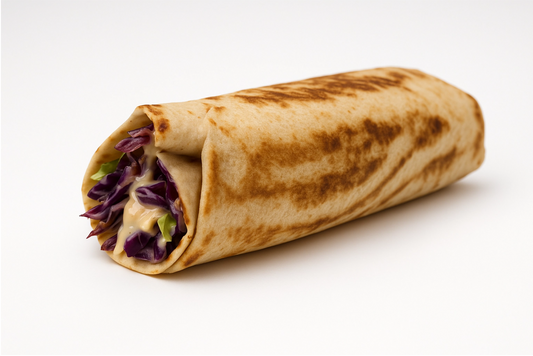 Rolled shawarma wrap with visible ingredients on a white background